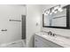 Contemporary bathroom with gray tile shower and white vanity at 350 E Minnesota St, Indianapolis, IN 46225