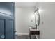 Stylish bathroom with a dark blue door and updated vanity with vessel sink at 350 E Minnesota St, Indianapolis, IN 46225