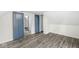 Spacious bedroom with wood-look flooring and a large closet at 350 E Minnesota St, Indianapolis, IN 46225