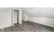 Cozy bedroom with wood-look flooring and a walk-in closet at 350 E Minnesota St, Indianapolis, IN 46225