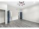 Spacious bedroom with dark gray flooring and ceiling fan at 350 E Minnesota St, Indianapolis, IN 46225
