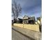Street view of a charming gray two-story home with wooden shutters and a new fence at 350 E Minnesota St, Indianapolis, IN 46225