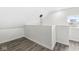 Spacious loft area with wood-look flooring and a large window at 350 E Minnesota St, Indianapolis, IN 46225