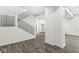Modern staircase with black metal railing and wood steps at 350 E Minnesota St, Indianapolis, IN 46225