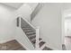 Elegant staircase with white risers and black metal railing at 350 E Minnesota St, Indianapolis, IN 46225