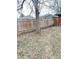 A fenced backyard featuring a tree in the yard on an overcast day at 4114 N Butler Ave, Indianapolis, IN 46226