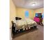 Bedroom featuring yellow walls, carpet flooring, and a window with blinds at 4114 N Butler Ave, Indianapolis, IN 46226