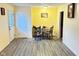 Open dining room showcasing laminate flooring, neutral walls, and natural light at 4114 N Butler Ave, Indianapolis, IN 46226