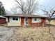 Charming brick home with new windows and a well-maintained front yard, offering great curb appeal at 4114 N Butler Ave, Indianapolis, IN 46226