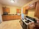 Efficient kitchen with modern appliances, granite counters, and oak cabinets at 4114 N Butler Ave, Indianapolis, IN 46226