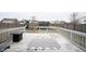 Outdoor wooden back deck perfect for entertaining with space for seating and dining at 5782 Jamestown Square Ln, Indianapolis, IN 46234