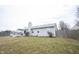 Large fenced backyard and back of home with wooden deck at 5782 Jamestown Square Ln, Indianapolis, IN 46234