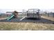 Backyard featuring a playset, trampoline and wood chip base at 5782 Jamestown Square Ln, Indianapolis, IN 46234
