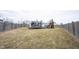 Large fenced backyard with grass, play set, and trampoline at 5782 Jamestown Square Ln, Indianapolis, IN 46234