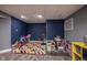 Finished basement area with colorful play rugs and toys at 5782 Jamestown Square Ln, Indianapolis, IN 46234
