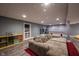 Spacious finished basement offers a large sectional sofa, pool table and wood-look flooring at 5782 Jamestown Square Ln, Indianapolis, IN 46234