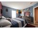 Bedroom featuring sports themed decor and wood dresser at 5782 Jamestown Square Ln, Indianapolis, IN 46234