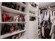 Well organized walk-in closet with ample storage space for shoes, clothing and accessories at 5782 Jamestown Square Ln, Indianapolis, IN 46234