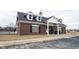 Brick clubhouse with bike rack and recycling and trash receptacles at 5782 Jamestown Square Ln, Indianapolis, IN 46234