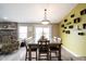 The well-lit dining room is open to the living area, featuring a large dining table at 5782 Jamestown Square Ln, Indianapolis, IN 46234