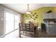 Bright dining room with sliding glass doors and an elegant lighting fixture at 5782 Jamestown Square Ln, Indianapolis, IN 46234