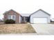 Charming single-Gathering home with brick and siding exterior and a well-manicured front yard at 5782 Jamestown Square Ln, Indianapolis, IN 46234