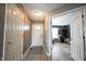 Inviting foyer with neutral walls, laminate floors, and views of the living space at 5782 Jamestown Square Ln, Indianapolis, IN 46234