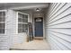 Cozy covered front porch features stylish decor and a 'Welcome' sign, creating a warm entry at 5782 Jamestown Square Ln, Indianapolis, IN 46234