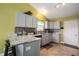 Well-appointed kitchen showcases gray cabinets and a beautiful backsplash, perfect for culinary enthusiasts at 5782 Jamestown Square Ln, Indianapolis, IN 46234