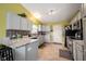 Modern kitchen with granite countertops, updated appliances, and ample cabinet space at 5782 Jamestown Square Ln, Indianapolis, IN 46234
