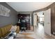 Versatile home office space with a desk setup, laminate flooring, and comfortable seating at 5782 Jamestown Square Ln, Indianapolis, IN 46234