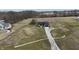 Expansive property showcases a modern single-story home with a long driveway and plenty of open land at 5802 Watson Rd, Greenwood, IN 46143