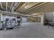 Large unfinished basement area with concrete floor, exposed ceiling, and exercise equipment at 5802 Watson Rd, Greenwood, IN 46143