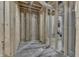 Unfinished basement with wooden framework, utility connections, and concrete flooring at 5802 Watson Rd, Greenwood, IN 46143