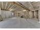 Spacious unfinished basement area featuring concrete floors, wooden framing, and a window at 5802 Watson Rd, Greenwood, IN 46143