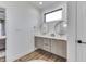Modern bathroom with dual sinks, floating vanity, and an accent rug for added comfort at 5802 Watson Rd, Greenwood, IN 46143