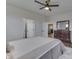 Bright bedroom featuring a large window, wood dresser, and doorways to other rooms at 5802 Watson Rd, Greenwood, IN 46143