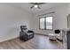 Bedroom features a ceiling fan, a window with a view, and comfortable seating at 5802 Watson Rd, Greenwood, IN 46143