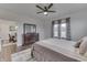 Cozy bedroom with natural light, dresser with mirror, and view into a spacious dining area at 5802 Watson Rd, Greenwood, IN 46143
