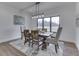 Beautiful dining room with a wooden table, comfortable seating, and a view of the outdoors at 5802 Watson Rd, Greenwood, IN 46143