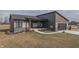 Beautifully landscaped modern home featuring a spacious front porch and an attached garage at 5802 Watson Rd, Greenwood, IN 46143
