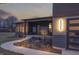 Illuminated walkway and modern design elements enhance this single Gathering home's curb appeal in the evening at 5802 Watson Rd, Greenwood, IN 46143