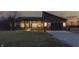Elegant single-story home with a modern garage, sleek entryway and a well manicured lawn at 5802 Watson Rd, Greenwood, IN 46143
