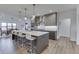 Modern kitchen featuring an oversized island with seating and sleek, stainless steel appliances at 5802 Watson Rd, Greenwood, IN 46143