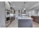 Spacious kitchen featuring modern appliances, a large island, and sleek countertops at 5802 Watson Rd, Greenwood, IN 46143