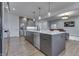 Contemporary kitchen with a large island, stainless steel appliances, and sleek gray cabinetry at 5802 Watson Rd, Greenwood, IN 46143