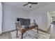 Bright office space with a ceiling fan, white walls, and modern desk setup at 5802 Watson Rd, Greenwood, IN 46143