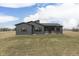 A modern home featuring dark gray siding and a screened-in back porch perfect for enjoying the outdoors at 5802 Watson Rd, Greenwood, IN 46143