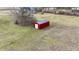 A red storage shed provides ample space for your outdoor equipment or hobbies in your new backyard at 5802 Watson Rd, Greenwood, IN 46143