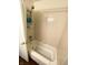 This bathroom features a bathtub with neutral tile surround and a handheld shower head at 5850 Bradston Way, Indianapolis, IN 46237